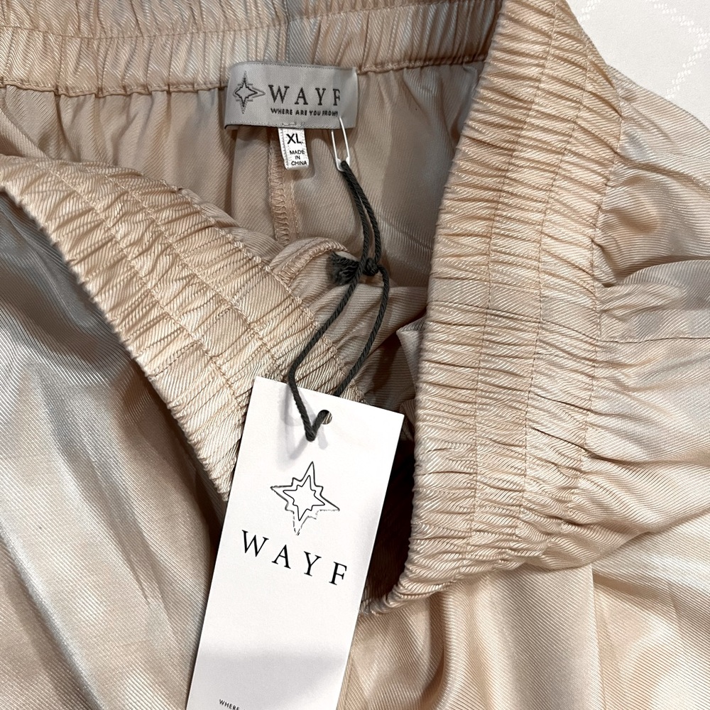 Elastic waste, cream colored, wide leg pants.